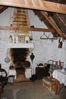 Inside the Highland Cottage, Highland Folk Museum
This is a reconstruction of a cottage from the 1890's. It has flagstones on the floor and consisted of only 3 rooms.  On each gable there are 'hanging lums' to take the smoke away.
