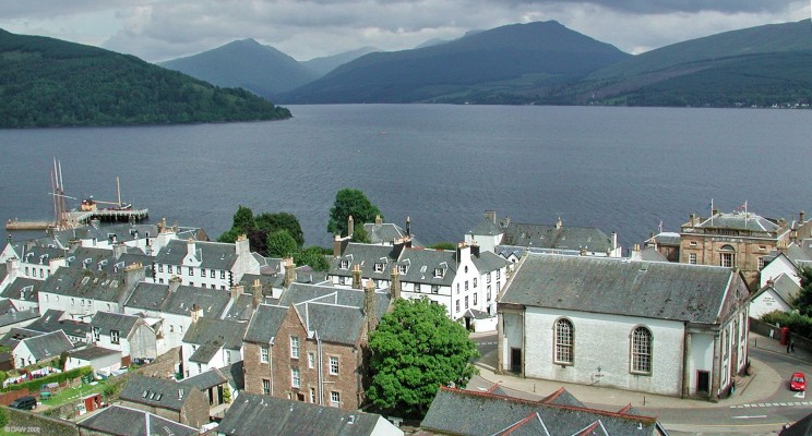 Inveraray from the Bell Tower
The large white building on the right is Glenaray and Inveraray Parish Church, it used to have a stone spire in the centre of the roof but this was removed in 1941 after concerns that it was unsafe with the vibration of heavy traffic passing close by.  The sandstone building behind the Church is the old Jail, now a museum.  [url=http://www.streetmap.co.uk/streetmap.dll?G2M?X=209460&Y=708470&A=Y&Z=3/]Map location[/url]
