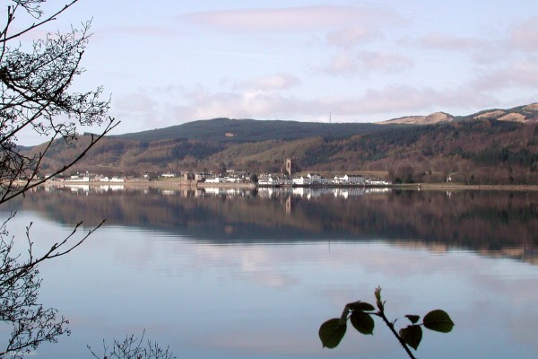 Late winter view of Inveraray from the shores of Loch Fyne
If you manage to be at Inveraray when the tide is in on a calm day the uniform white buildings make a pleasing  reflection on Loch Fyne.  The 126ft high Bell Tower of All Saints Episcopal Church can be seen towering above everything else.
