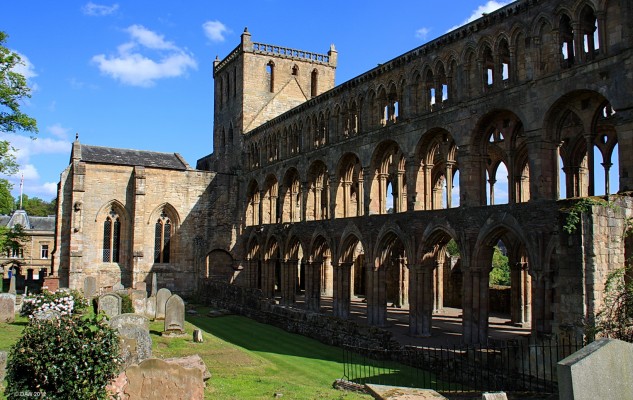 Jedburgh Abbey
The ruins of the 12th century Augustinian Abbey in Jedburgh.  Due to its proximity with the border the Abbey was ransacked by the English many times but its end didn't come till 1560 at the time of the Reformation in Scotland.  The western Nave was used as a church until 1871 when a new parish church was built.  The northern Transept seen here is the only part with an intact roof.  The Abbey was handed over to the care of Historic Scotland in 1917.
