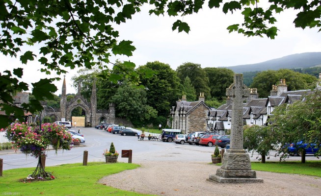 Kenmore village
Kenmore is an attractive little village that sits at the eastern end of Loch Tay.  It was built as a planned estate village by the Earl of Bredalbane from 1755.  This view is looking out into the village square, the celtic cross is the war memorial.  [url=http://www.streetmap.co.uk/map.srf?X=277263&Y=745452&A=Y&Z=115/] Map location. [/url]
