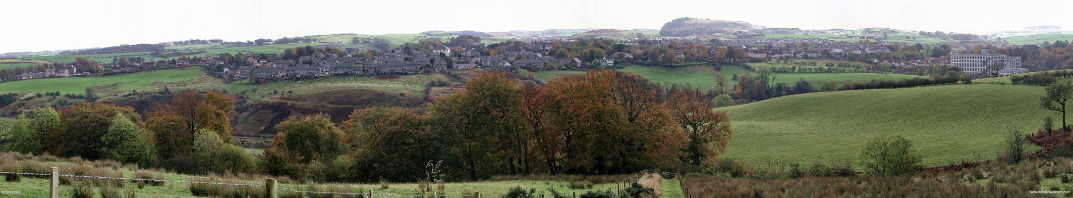 Autumn Panorama from Killoch Glen
An autumn view over looking Neilston from the top of Killoch Glen taken in 2005.  Crofthead Mill is on the extreme left.  The Neilston Pad is on the horizon right of centre.  [url=http://www.streetmap.co.uk/map.srf?X=247929&Y=658194&A=Y&Z=120/] Map location. [/url]
