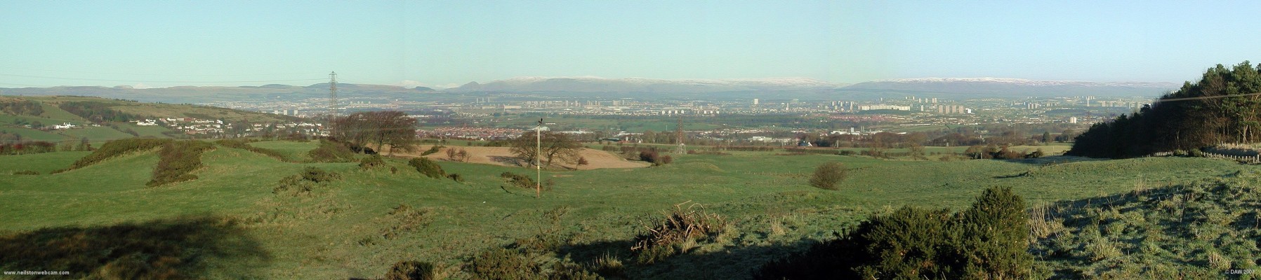 Panoramic view from Kirkton Road
Taken from the Barrhead end of Kirkton Road looking north over Glasgow on a cold winter day.  Barrhead can be seen climbing up the Fereneze Hills on the left.  The hills to the North of Glasgow have a light dusting of snow.
