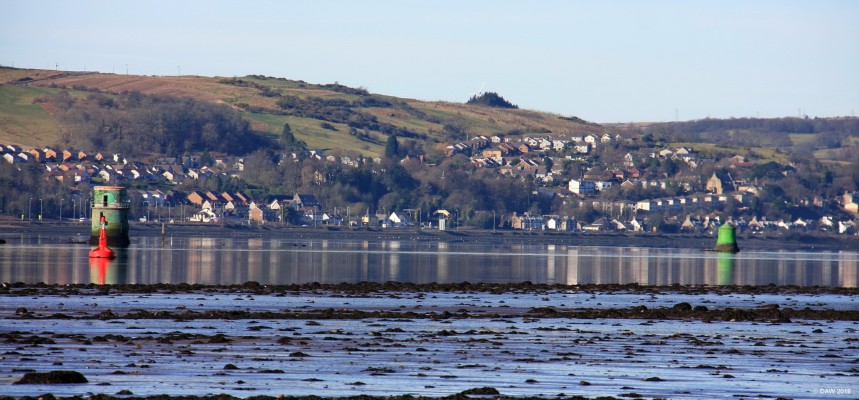 A view of Langbank from Milton
Looking south across the Clyde towards Langbank.  The Green marker towers you see are what is left of The Long Dyke, an ingenious 18th century piece of engineering designed by John Golbourne to scour out a deeper navigation channel in the River Clyde.  By narrowing the main flow of water it increased the flow rate thus increasing the natural scouring power of the water to clear silt and keep the channel deeper. [url=http://streetmap.co.uk/map.srf?X=242300&Y=673850&A=Y&Z=120/] Map location. [/url]
