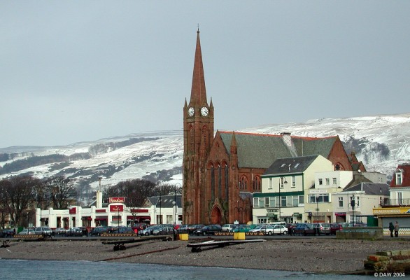 Largs Seafront, Winter
This winter view shows two of the prominent buildings in Largs, St Columba's Church dating from 1892 and Nardini's Cafe to its left.  Nardini's has been famous for its Ice Cream for as long as I can remember, no trip to Largs is complete without a visit, although you might need to save up for it!
