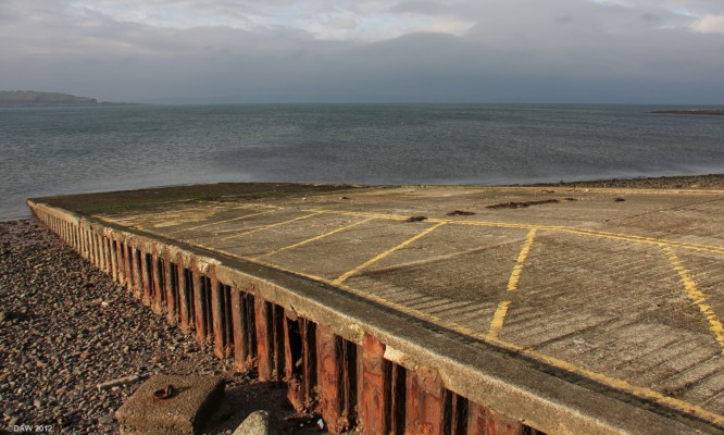 The former Sea Plane slipway at Largs
As you pass the Life Boat station at Largs you would hardly give this slipway a second glance.  It was built in 1942 by Scottish Aviation for the purpose of bringing Catalina Sea Planes out of the water for servicing across the road on what is now the Barrfields putting green.  By the summer of 1944 as many as 18 Catalinas, 2 Coronados and 2 Mariners were in Largs Bay.  In total some 300 Catalinas were serviced here at Largs during the war. 
