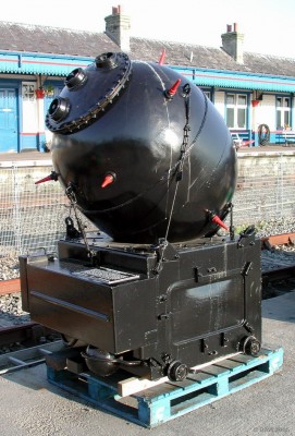 Left luggage, Kyle of Lochalsh railway Station
This unusual delivery was spotted at Kyle of Lochalsh railway station in late summer 2002.  It's a commemoration of the connection the area had with the Royal Navy during the 2nd World War and now sits in from of the Lochalsh Hotel.
