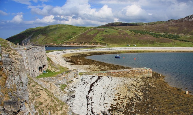 Lime kilns, Ard Neackie
On the left you can see 4 disused line kilns, built around 1870.  The quarry was behind the kilns, the lime was transported from here by ship.  Lime was used as a neutralising agent, when reclaiming peaty soils for cultivation.  [url=http://www.streetmap.co.uk/map.srf?X=244633&Y=959590&A=Y&Z=115/] Map location. [/url]


