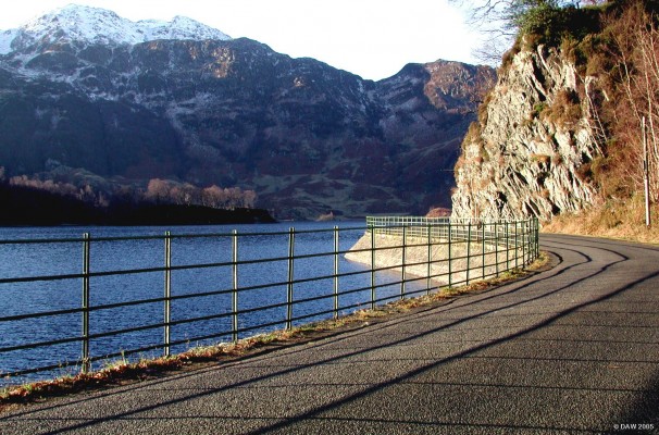 Winter sun at Loch Katrine
Loch Katrine is one of the main sources of drinking water for the  City of Glasgow.    The Loch Katrine Scheme was opened by Queen Victoria on October 14th 1859.  The level of the loch was raised by four feet and an aqueduct 26 miles long with a fall of just 10 inches per mile was constructed to Milngavie, on the north side of Glasgow. 
