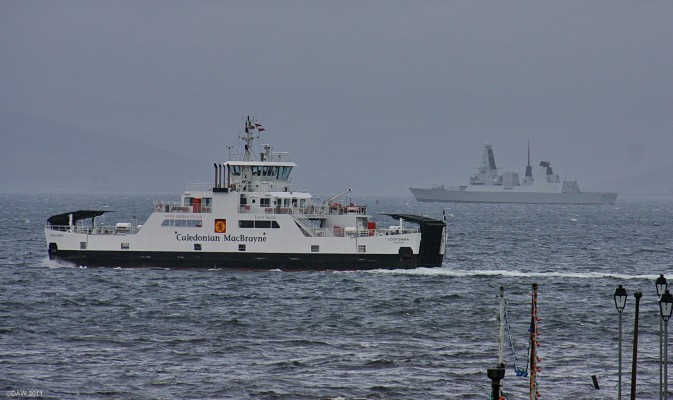 HMS Diamond, Largs
The Cumbrae ferry Loch Shira passes in front of HMS Diamond anchored near Largs in late 2009.   Diamond was completed at BAE Systems Scotstoun ship yard on the upper Clyde earlier that year and was undergoing sea trials.

