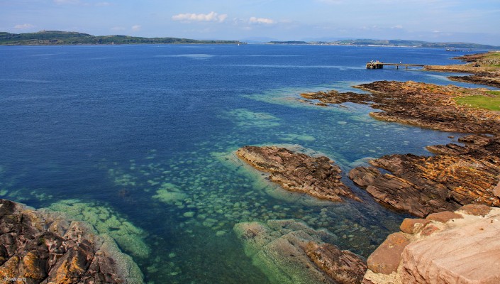 Looking North West from Portencross Castle
A view from the roof of Portencross Castle, on the left is the Wee Cumbrae, towards the right is the Great Cumbrae with the town of Millport visible in the distance.
