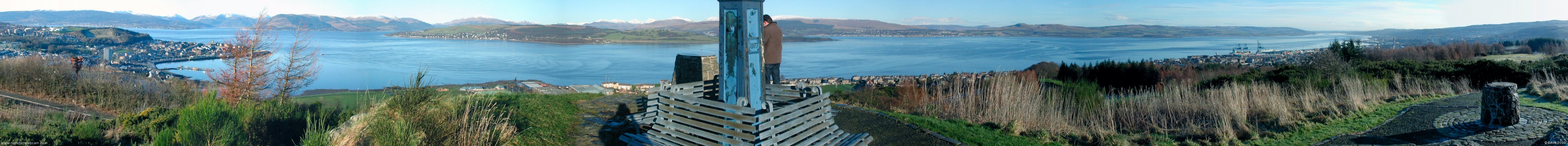 Panoramic view from Lyle Hill over looking Gourock and Greenock and the lower Clyde
Gourock is on the left hand side, above that on the opposite side of the Clyde is the Holy Loch.  To the right of that is the entrance to Loch Loch.  Kilgreggan is directly opposite and the entrance to Gare Loch is to the right of that with Helensburgh in the background.  On the right hand side is Greenock with the river Clyde heading up to Glasgow.  [url=http://www.multimap.com/map/browse.cgi?lat=55.9555&lon=-4.794&scale=25000&icon=x]Map Location[/url]

