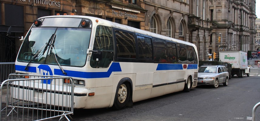 MTA Bus, World War Z, Glasgow
Metrapolitan Transportation Authority Bus.  I'd let this bus pass me by, look at the holes in the roof above the windows.
