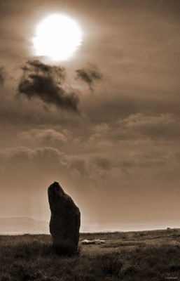 Machrie Moor, Arran
One of the smaller group 2 standing stones at Machrie Moor.  Although not the largest this stone is still higher than a person standing.  Dating from some 4,500 years ago many believe the alignment of the stones have astronomical significance.  This photo shows a rather sulty Sun behind the stone. [url=http://www.streetmap.co.uk/streetmap.dll?G2M?X=191000&Y=632430&A=Y&Z=3/]Map location[/url]
