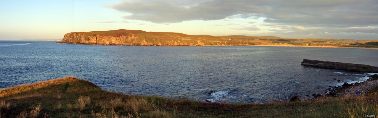 Melvich Bay, Caithness
Looking out from Portskerra with the evening sun shining across Melvich Bay.  On the right is the long sandy beach at Melvich and in the distance on the left is Dounreay.  [url=http://streetmap.co.uk/map.srf?X=288183&Y=965801&A=Y&Z=120/] Map location. [/url]
