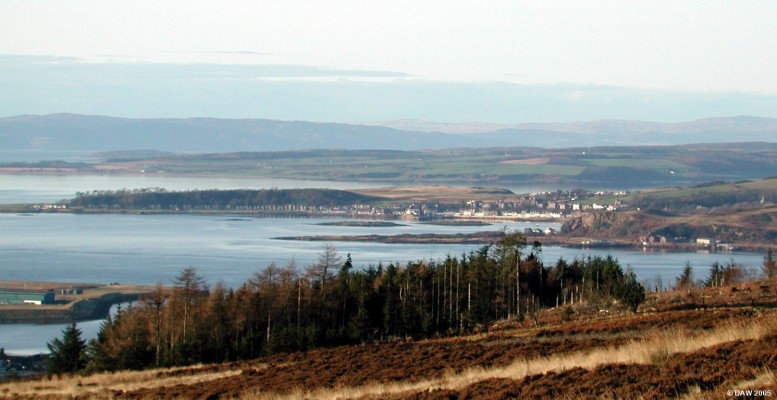 Millport as seen from Fairlie Moor
A winter view of  Millport Bay and the town of Millport from the Fairlie Moor road.  Millport sits at the end of The Great Cumbrae island in the Firth of Clyde.  On the extreme right hand side of the picture the old Keppel pier and Marine Station can be made out and on the lower left is the now disused oil rig construction yard at Hunterston.
