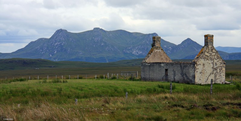 Moine House, Sutherland
The ruins of Moine house with Beinn Stumanadh rising to 527m in the background.  The house dates from around the 1930's when the first road was built across the moor from Loch Eribol to the Kyle of Tongue.  This was a half way stop.  The modern road no skirts around the cottage. [url=http://streetmap.co.uk/map.srf?X=251819&Y=960106&A=Y&Z=126/] Map location. [/url]
