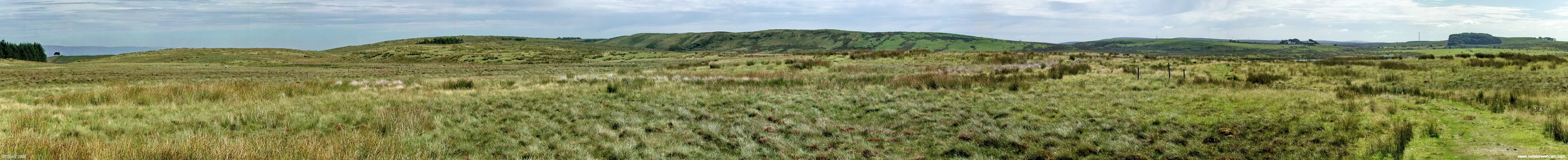 Panoramic view over Moyne Moor, East renfrewshire
Moyne moor is an area of bog land that lies to the south of Neilston.  James's Hill can be seen in the distance, Long Loch lies just in front of it and can just be seen on the extreme right.  This view may change if planning permission is granted [/url=http://www.gamesa.es/files/File/Non%20Technical%20Summary%20with%20cover.pdf/]Harelaw Energy Park [/url] which will lead to 40 large 2MW wind turbines being erected in this area.
