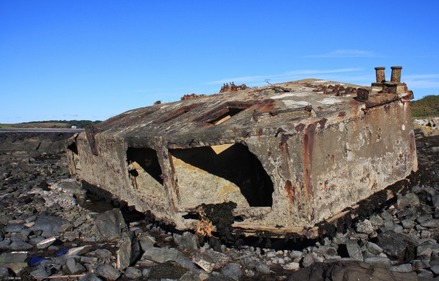 Mulberry Harbour 'Beetle' , Garlieston, Dumfries and Galloway
During World War II Garlieston was one of the sites where parts of the Mulberry Harbour used for the D-Day invasion were assembled and tested.  This is one of two 'beetles' that remain on the beach at Garlieston Bay.  Several were being towed by a tug in poor weather when they broke free and ended up on the rocks where they have remained for 70 years.
