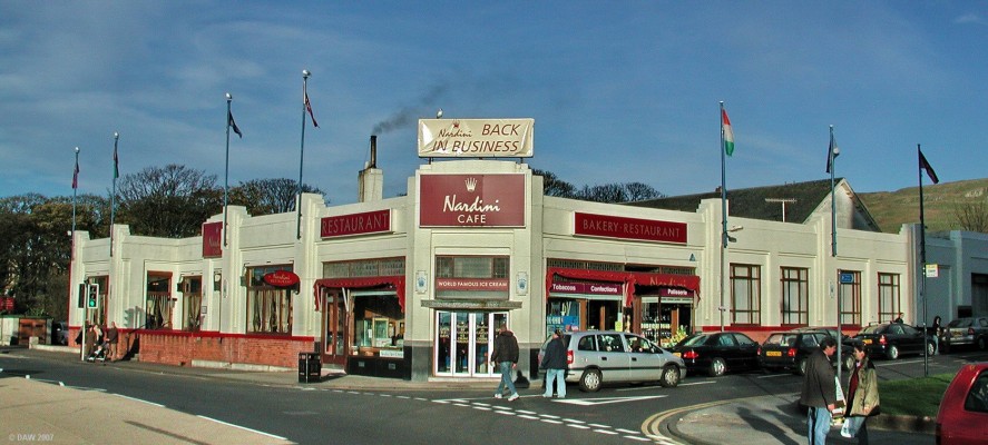 Nardini, Largs
The name Nardini's and Largs are inseperable.  This art deco building has been the source  of quality icecream for day trippers since the 1930's.   A day in Largs was  incomplete without a visit to Nardini's.  Sadly the business got into problems in the last few years and this photo was taken in 2004 shortly before it "temporarily" closed for refurbishment.  At the time of writing in 2007 there is still no sign of work being carried out on the restoration of the building.
