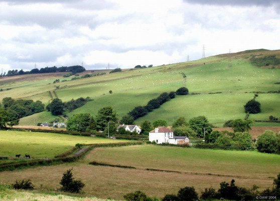 Over looking Neilston Road
Neilston road runs along the centre of the picture with the Fereneze hills in the background, the white dots are sheep :-)
