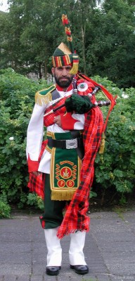 2006, A member of the Patiala pipe band from Pakistan shows off his colourful uniform.

