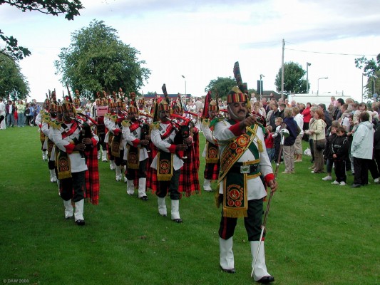 The Patiala pipe band at Pig Square during Neilston Live! 2006
The Patiala pipe band from Pakistan was established in 1948.  Most of its member are former members of the Pakistan Army and all have been trained at the Pakistan Army School of Music.  They participate in civil and government functions in Pakistan and have also taken part in The Edinburgh Tatoo and Scottish Pipe Band Championships.
