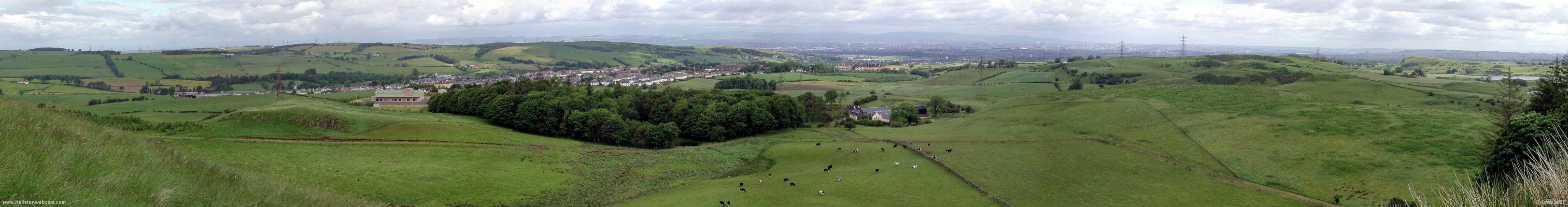 Panoramic view from top of the Neilston Pad
On the left are the lochliboside hills and in the sun on the right is "the Cragie" or Duncarnock Hill to give it its Sunday name.  Below Neilston is the Glasgow conurbation spread across the valley.  On a good day you can make out the Kirk 'o Shotts television mast on the flat horizon to the right, a distance of some 25 miles as the crow flies. [url=www.multimap.com/map/browse.cgi?lat=55.7685&lon=-4.4298&scale=25000&icon=x/]Map location[/url]
