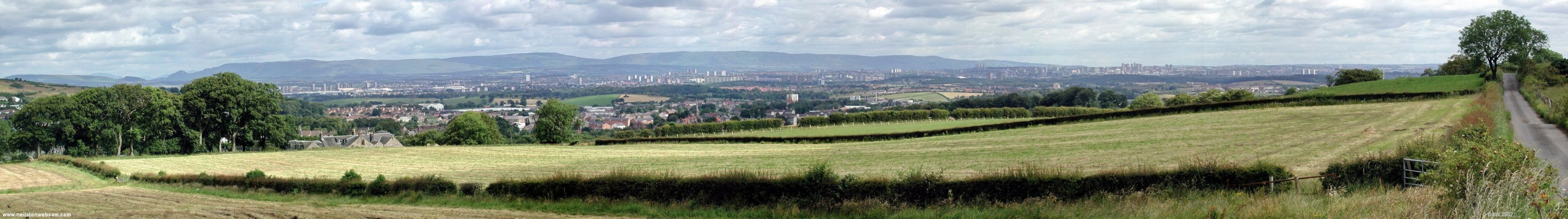 Panoramic view from Springfield road
On the extreme left you can just see the Ferenze hills with Barrhead closest and Glasgow spread across the width of the photo in the distance.  If you know where to look, this photo from summer 2002 shows the now demolished tower block in Barrhead.  [url=www.multimap.com/map/browse.cgi?lat=55.7867&lon=-4.4097&scale=25000&icon=x/]Map location.[/url]
