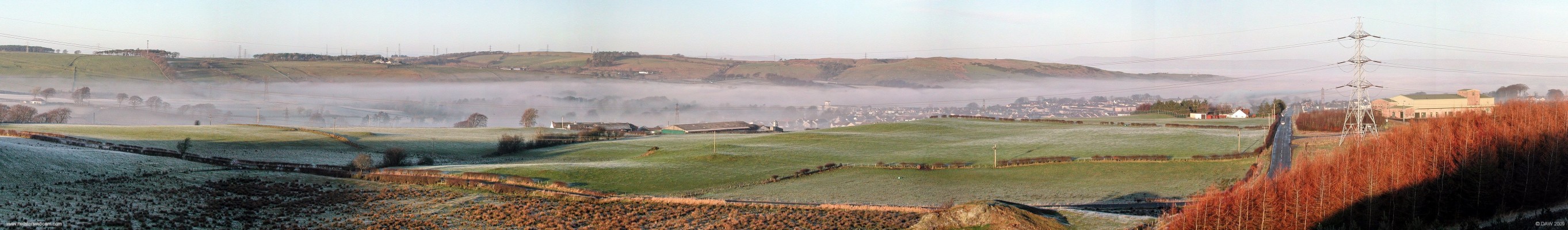 Neilston in fog
Over looking Neilston from East Renfrewshire Community Woodland.  Taken on Christmas Day 2005, a layer of fog appears to be covering the whole of Glasgow but is only just reacing up the the height of Neilston.  The water treatment works are on the right witha view looking straight down Kingston road.  You can make out the top of the Mill building in the centre and Kilburn farm is to the left of centre.  [url=http://www.streetmap.co.uk/map.srf?X=247207&Y=655561&A=Y&Z=120/] Map location. [/url]
