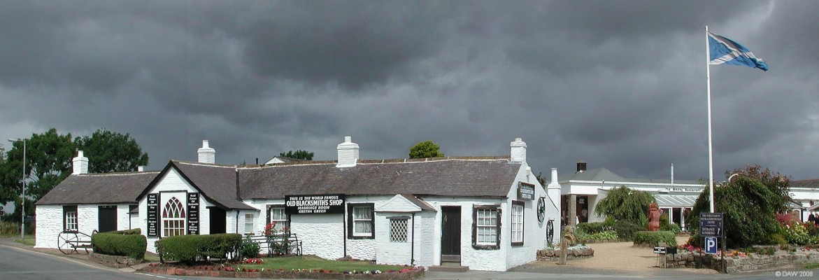 Old Blacksmiths Shop, Gretna
One of Scotland's oldest visitor attractions.  In 1886 the owner, Hugh Mackie, decided to open the cottage and workshop to visitors, no doubt because at that time it was on the main route across the border, today it is by-passed by the Motorway but that hasn't stopped Hugh Mackie's great Grandson from expanding the shop and continuing to sell Tartan dolls to unsuspecting visitors from England and further abroad.
