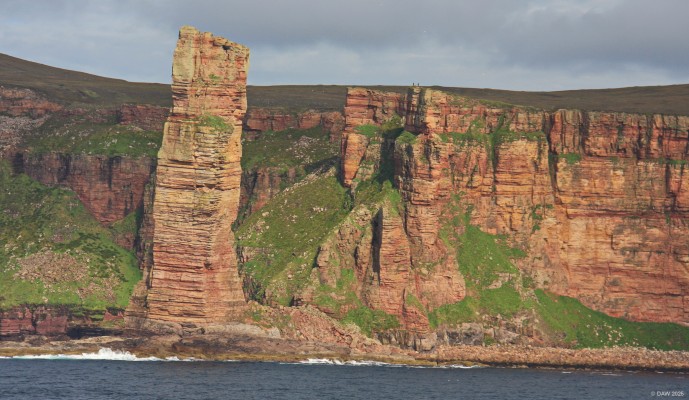 The Old Man of Hoy
A sea stack on the Island of Hoy.  The stack is only a few hundred years old, caused by erosion of a cliff by the sea.  It rises to 137m (449ft) and is popular with climbers.  You can see some people stand above it to the right which gives an idea of the scale.  The stack is visible from the car ferry route between Thurso and Stromness.  At some point in the future the stack will likely collapse into the sea.  [url=http://streetmap.co.uk/map?X=316465&Y=1000722&A=Y&Z=120/] Map location/ [/url]
