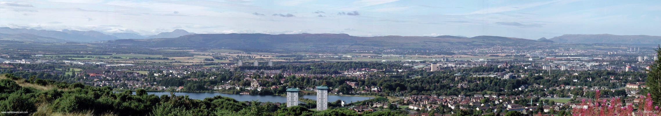 Paisley from Paisley Golf Course
Taken from the car park of Paisley Golf Club on top of the Gleniffer Braes.  The familiar outline of Ben Lomond can be seen left of centre.  Stanley Rservoir is in the foreground.  [url=http://www.streetmap.co.uk/map.srf?X=246917&Y=660365&A=Y&Z=115/] Map location. [/url]
