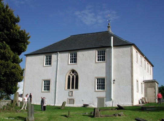 Neilston Parish Church, rear view June 2004
The back of the [url=www.neilstonparishchurch.org.uk/]Church[/url], viewed from the Graveyard.  The bricked up opening below the arched window is the old vault, the last internment was that of Col. Mure of Caldwell  who died in 1912.
