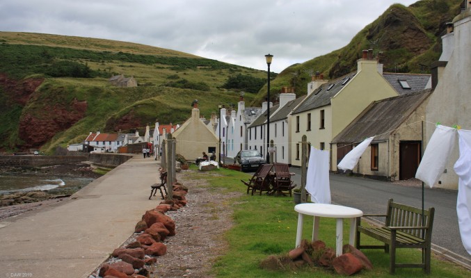 Pennan, Aberdeenshire
Pennan is a typical Aberdeenshire coastal fishing village, there's only room for the houses and a road along the front below the cliffs.  Crovie along the coast doesn't even have room for the road.  The washing is dried in front of the houses.  [url=http://streetmap.co.uk/map.srf?X=384475&Y=865540&A=Y&Z=120/] Map location. [/url]
