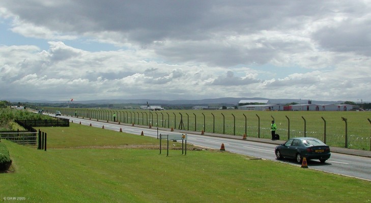 Perimiter Fence, Prestwick Airport, G8 Summit, July 2005
The security operation for G8 was so big that police had to be drafted in from Wales, Yorkshire, Cheshire and even Cornwall.  This particlar stretch of the Airport fence near Monkton was policed by good humoured officers from Wales.  A routine Ryan Air flight can be seen landing.
