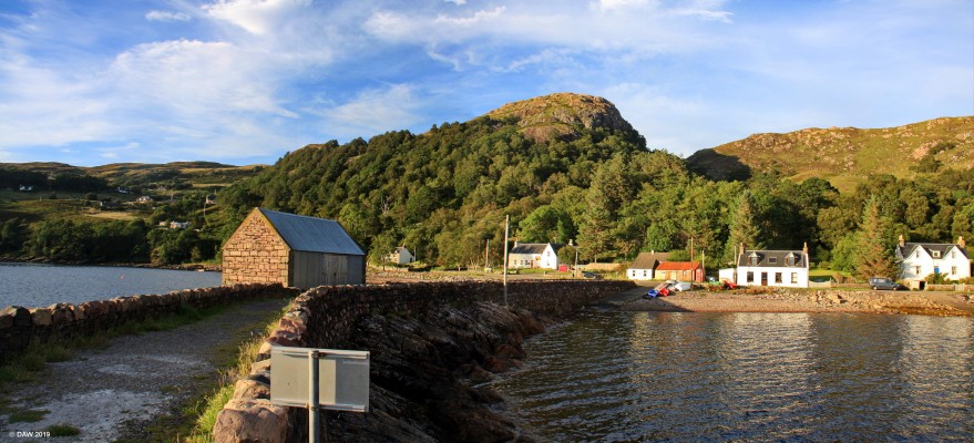 The pier at Lower Diabaig
Built on a rocky outcrop know as Sgeir Ghlas (Grey skerries), the evening sun lights up the hills behind.  [url=https://streetmap.co.uk/map.srf?X=179691&Y=859808&A=Y&Z=115/] Map location. [/url]
