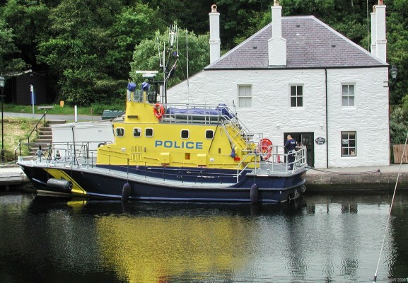 Police Launch at Crinan Canal basin
"Strathclyde", the Strathclyde Police Launch, comissioned in 2004 after serving for 21 years as the RLNI Penlee lifeboat.  The Marine Police Unit was formed by Glasgow City Police in 1936 and continued until 1991 when it was axed for financial reasons.   In 2004 it was decided to re-instate the unit, the Strachclyde Police area does after all cover hundreds of miles of coastal waters.
