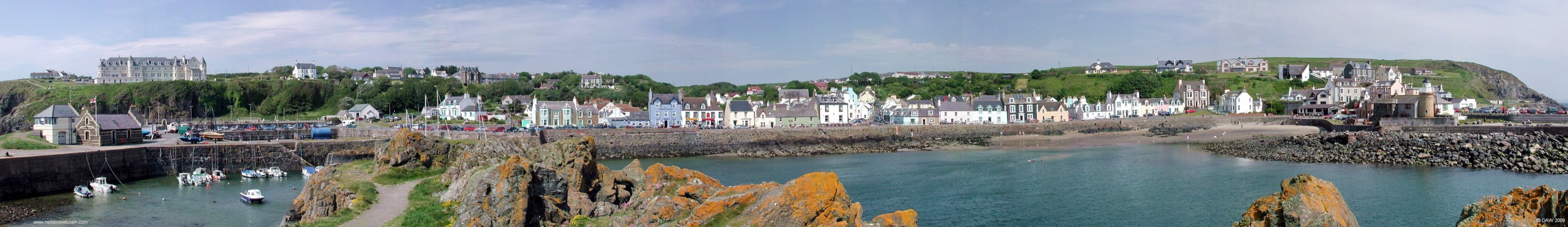 Panorama of Portpatrick seafront
Port Patrick dates back around 500 years and developed as a fishing village with its natural harbour.  Today it is a pleasant day trip or holiday location for many.   The Port Patrick Hotel is on the cliffs on the left and dates back 100 years.  The lifeboat station is at the harbour below.  [url=http://www.streetmap.co.uk/map.srf?X=199802&Y=554073&A=Y&Z=115/] Map location. [/url]
