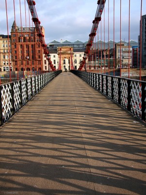 Portland Street Suspension Bridge
Shadows in the morning sun, looking North across the Portland Street footbridge which crosses the River Clyde in the City Centre.
