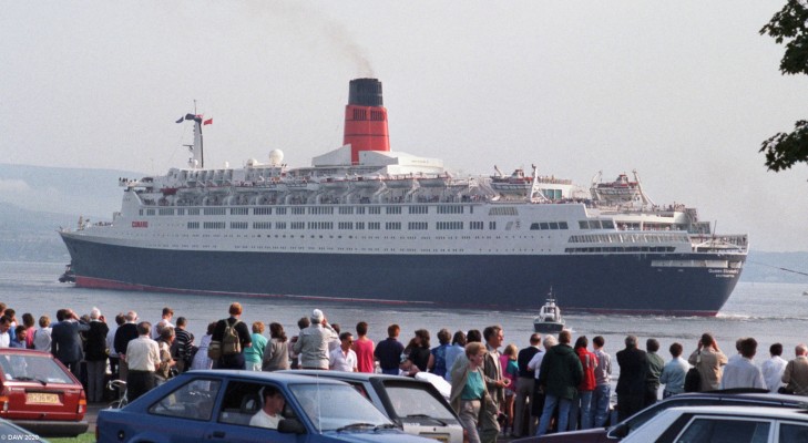 QE2, Greenock July 1990
Taken on the 25th of July 1990 on the day of the QE2's first return to the Clyde since being completed by John Brown's ship yard on the upper Clyde  in 1968.  The esplanade was lined with crowds of people all wanting a glimpse of the last Ocean Liner built on the Clyde.

