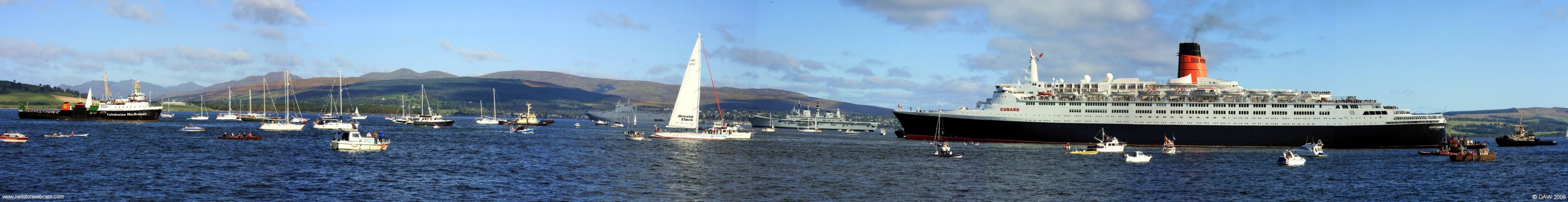 QE2 heads for Saturn
Actually, MV Saturn on the left was going astern at the time the photo was taken and the QE2 was being pulled astern by tugs.  The flotilla of boats all around where there to greet the QE2 on her last ever return visit in October 2008 to her birth place, the River Clyde.   The QE2 was launched about 20km further up river at John Brown's Ship yard in Clydebank  in 1967.   [url=http://www.streetmap.co.uk/streetmap.dll?G2M?X=226705&Y=677685&A=Y&Z=3/]Map location.[/url]
