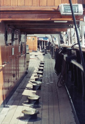 RRS Discovery deck, Dundee 1990
A view of the deck of RRS Discovery when she was moored at Victoria Dock in 1990.  The line of short posts are light shafts taking light into cabins below deck.  There are no port holes on the Hull of Discovery to increase its strength.
