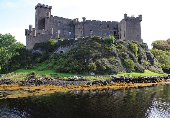 Seaward side of Dunvegan Castle
The Castle you see today is a 'romantic restoration' that was carried out by the 25th Chief between 1840 and 1850.  In its early days the water of Loch Dunvegan surrounded the castle on all sides and it was only in 1748 that a landward door was created.  The original sea gate can be seen lower down on left. [url=http://www.streetmap.co.uk/map.srf?X=124653&Y=849080&A=Y&Z=115/] Map location. [/url]
