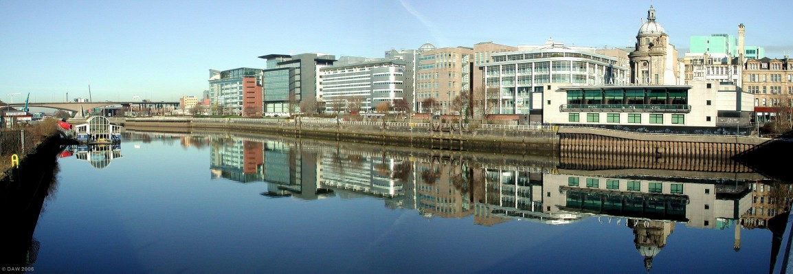 River front view, Glasgow City centre
This view along the north bank of the river Clyde shows the dramatic transformation that has taken place on the riverside in the City Centre. Its still on going and will probably take another 5-10 years before all the varies schemes are complete. On the left in the distance one of the old Renfrew Ferries can be seen, now used for functions, behind that is the Kingston Bridge carrying the M8 through Glasgow. On the right hand side behind the Casino the building with the dome is the Clyde Port Authority.
