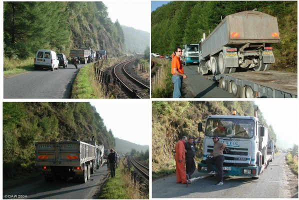 Road block,  Loch Carron
This is what happens on a single track road when a lorry breaks down.  To make matters worse the rescue attempt failed when the steel tow bar broke and smashed the cab after an attempt to push the lorry up onto the low loader, no one was hurt but it would make an interesting insurance claim.  Hard to believe but this is the A890 trunk road and the alternative would be a 100 mile detour.  www.leiths-group.co.uk
