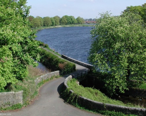 Ryat Linn Reservoir
Over looking the Ryat Linn reservoir, now part of the 'Dams to Darnley' country park.  In the distance is the red brick railway viaduct and above that the tower block of Glasgow can be seen.  [url=http://www.streetmap.co.uk/map.srf?X=251775&Y=657050&A=Y&Z=115/] Map location. [/url]
