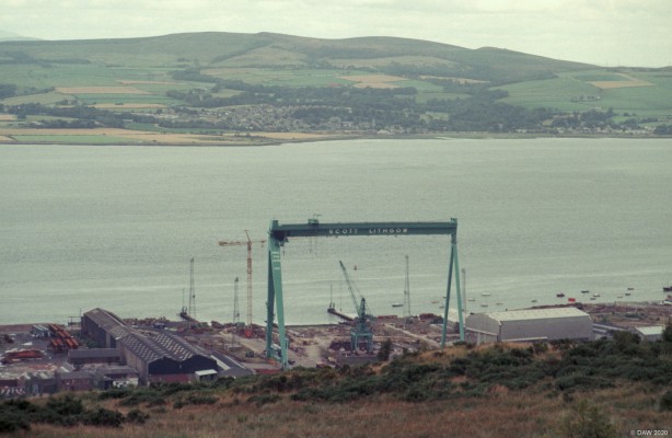 Scott Lithgow shipyard, Greenock, 1989
Scott Lithgow was formed in 1967 by the merger of two companies but in 1977 was nationalised and came under British Shipbuilding.  By the 1980's it was working on Semi-submersables for the North Sea but was suffereing from huge losses.  The yard finally closed in 1993 and today is a retail park.  The crane you see could lift 225 tons and was a local landmark.  [url=http://www.streetmap.co.uk/map.srf?X=232069&Y=673689&A=Y&Z=115&ax=230762&ay=673884/] Map location. [/url]

