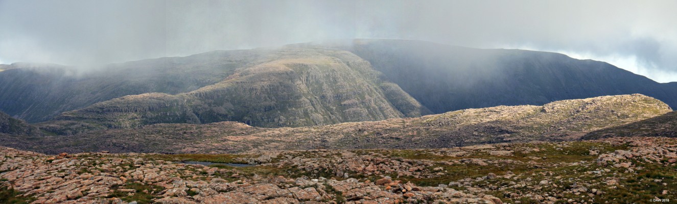 Sgurr a Chaorachain
This is one of the views from the top of the highest public road in Britain.  Unfortunately, the best view looking in the other direction towards Skye was obscured by low cloud.   The highest point you see in the distance is 792m.  You can see part of the single track road in the foreground.  [url=http://streetmap.co.uk/map.srf?X=177419&Y=842310&A=Y&Z=120/] Map location. [/url]

