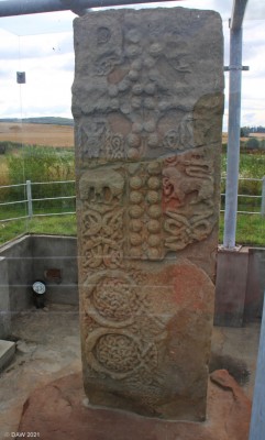The Shandwick Pictish Stone, Easter Ross
Known as Clach a'Charridh it stands in its original position overlooking the village of Shandwick.  It stands 2.7m high and the face you see here has a prominent cross formed of produding Bosses.  The stone blew down and broke in half in 1846 but has now been restored and encased in glass to protect it.   [url=http://streetmap.co.uk/map?X=285538&Y=874793&A=Y&Z=120/] Map location. [/url]
